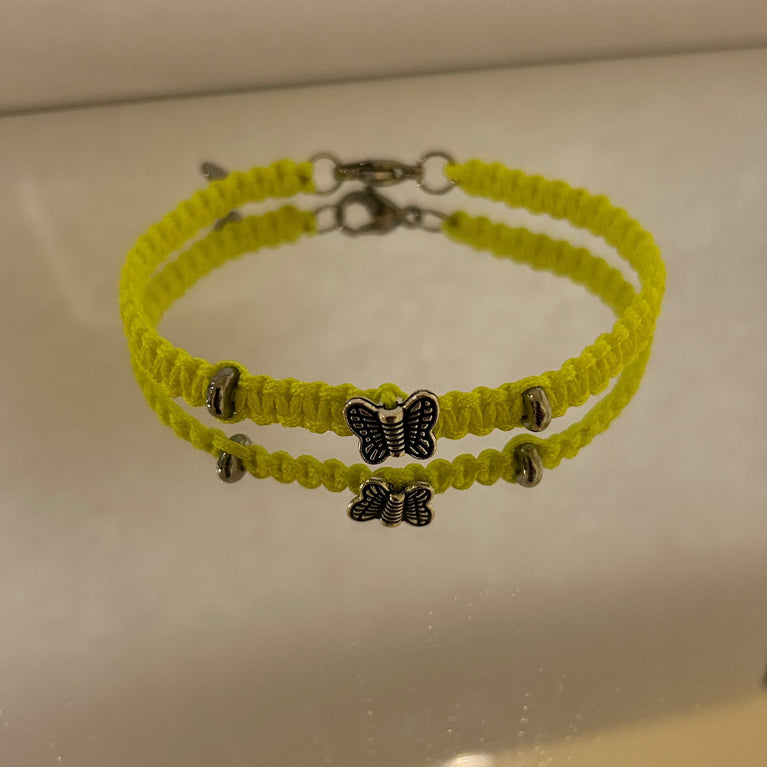 Paracord bracelet with steel butterfly charm and double ring