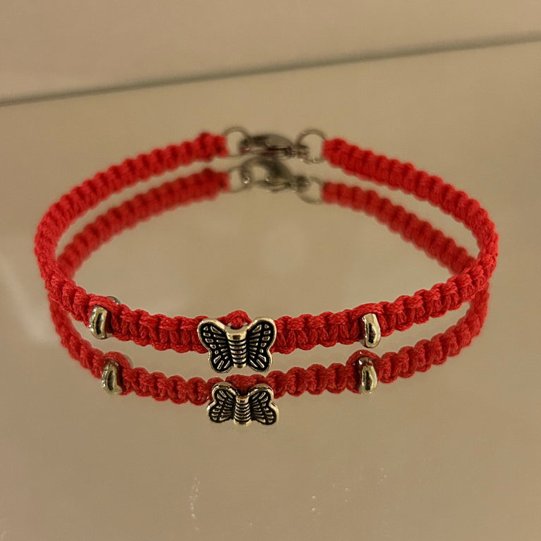 Paracord bracelet with steel butterfly charm and double ring